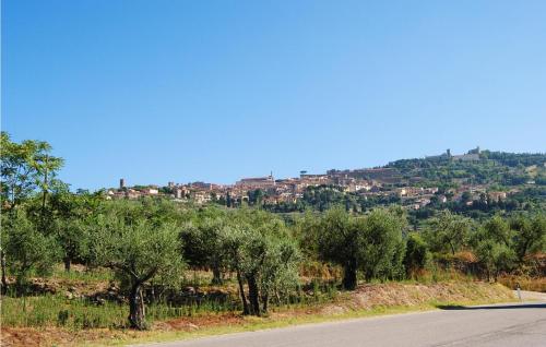 a road with trees and houses on a hill at Villa Margherita in Poggioni