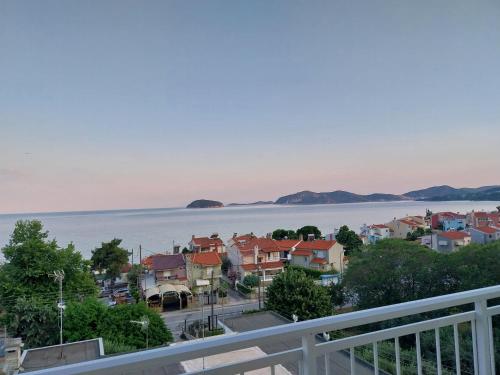 a view of a city and the water at Antony's by the sea apartment in Paleo Tsifliki
