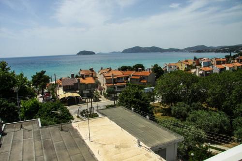 an aerial view of a town with the ocean at Antony's by the sea apartment in Paleo Tsifliki