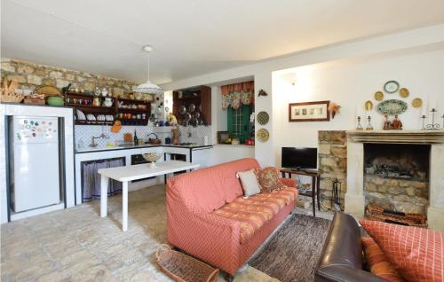 a living room with a couch and a fireplace at Beautiful Home In Rosolini With Wifi in Rosolini
