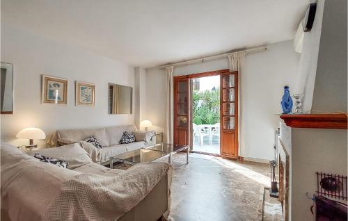 a living room with a couch and a table at Beautiful Apartment In Estepona in Estepona