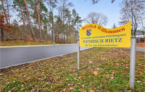 a yellow sign on the side of a road at Gorgeous Home In Wendisch-Rietz in Wendisch Rietz