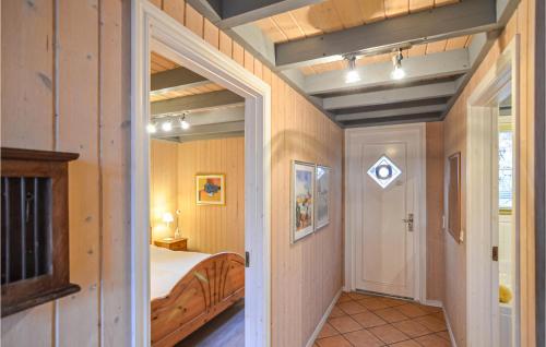 a bedroom with a bed and a door to a hallway at Gorgeous Home In Wendisch-Rietz in Wendisch Rietz