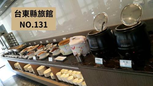 a display case in a store with pots and pans at Kaishen Starlight Hotel in Taitung City
