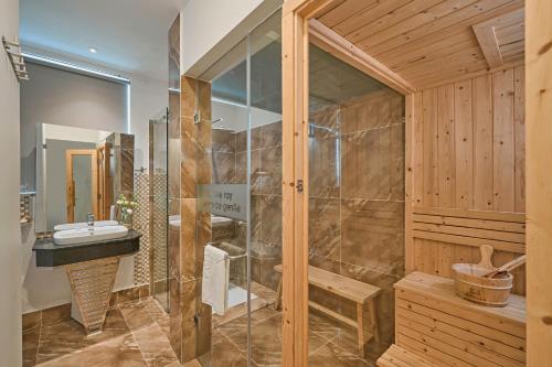 a bathroom with a shower and a sink at California Hotel in Da Lat