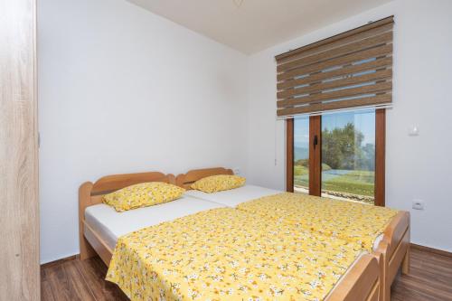 Postel nebo postele na pokoji v ubytování Jasen Apartments Lakeview