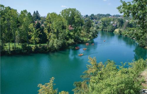 an aerial view of a river with people in boats at Studio Holiday Home In Galovic Selo in Galović-Selo