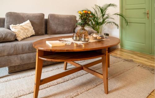 a wooden coffee table in a living room with a couch at Gorgeous Apartment In Otocac With Sauna in Otočac