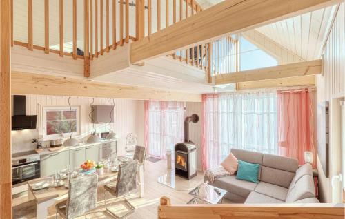 a living room with a couch and a fireplace at Gorgeous Home In Zerpenschleuse in Zerpenschleuse