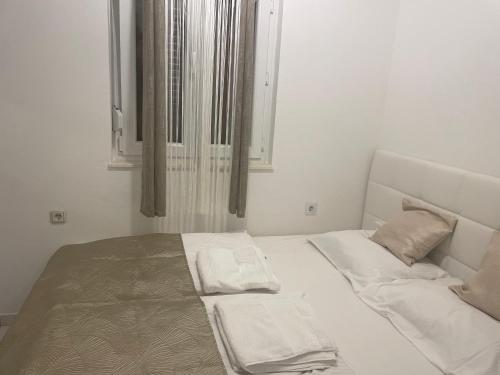 Ένα ή περισσότερα κρεβάτια σε δωμάτιο στο Apartment Denisse