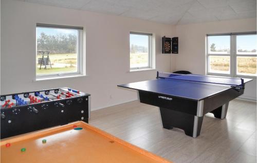a room with a ping pong table and a pool table at Beautiful Home In Ansager With Wifi in Ansager