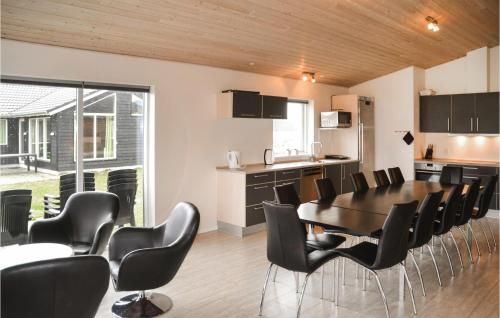 a kitchen and dining room with a table and chairs at Beautiful Home In Ansager With Wifi in Ansager