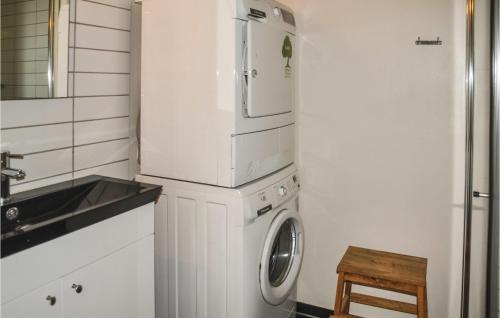 a small kitchen with a refrigerator and a washing machine at Beautiful Home In Ansager With Wifi in Ansager