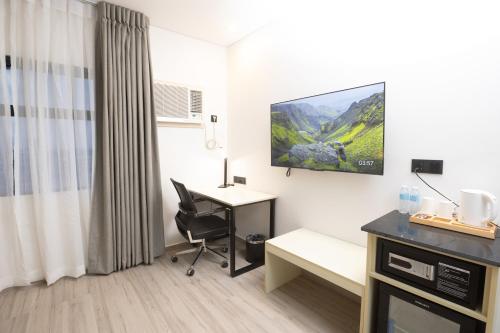 TV a/nebo společenská místnost v ubytování Hamersons Hotel CDO