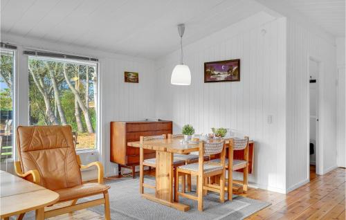 a dining room with a table and chairs at Holiday Home Græsted With Fireplace 02 in Græsted
