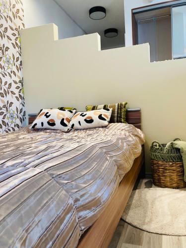 a bedroom with a large bed with pillows on it at Comfy Camel Apartment in Budapest