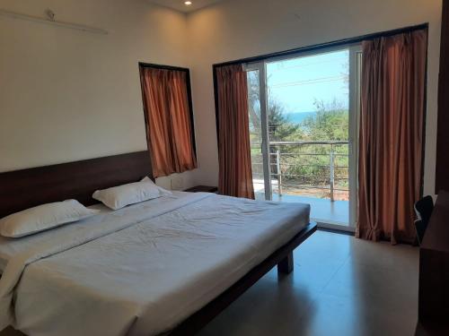 Postel nebo postele na pokoji v ubytování Raapan Beach Resort