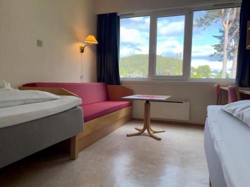 Postel nebo postele na pokoji v ubytování BORG Sommerhotell
