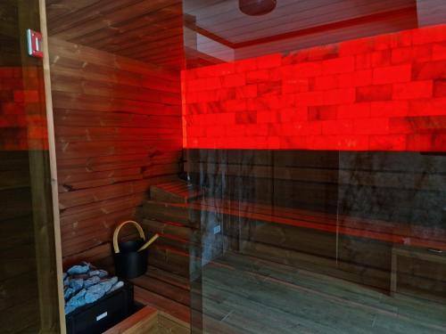 a sauna with red bricks on the wall at COLT DE RAI-Deluxe & Spa in Reşiţa