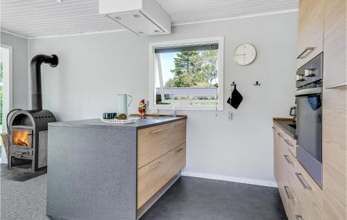 a kitchen with a counter and a stove at 6 Bedroom Cozy Home In Slagelse in Slagelse