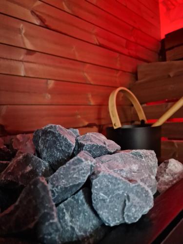 a pile of rocks sitting next to a pot of coal at COLT DE RAI-Deluxe & Spa in Reşiţa