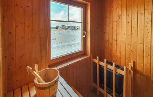 a window in a room with a view of the beach at Bi De Mar in Olpenitz