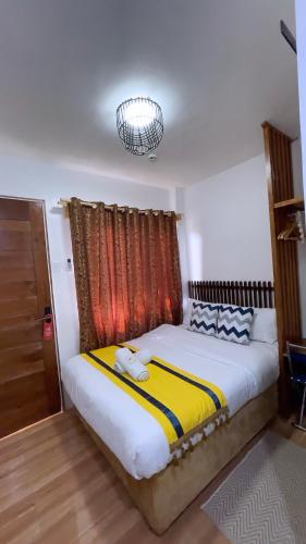 Postel nebo postele na pokoji v ubytování Mactan Hostel