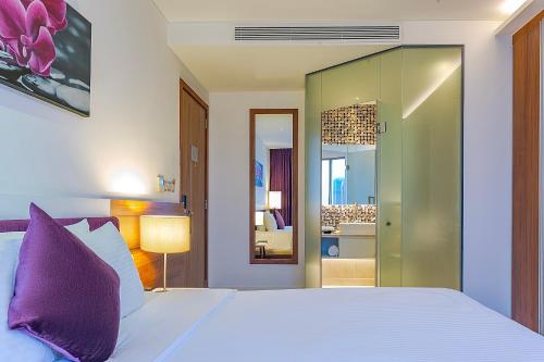 Postel nebo postele na pokoji v ubytování Vanda Hotel