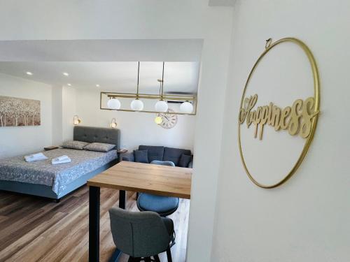 a room with a bed and a table and a mirror at Apartment Mara&Padrona in Zadar