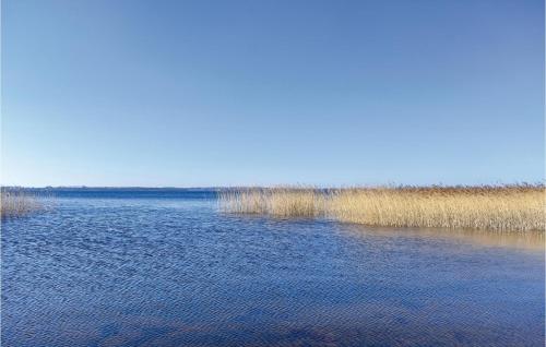 a large body of water with grass in the background at Gorgeous Home In Hörby With Kitchen in Hörby