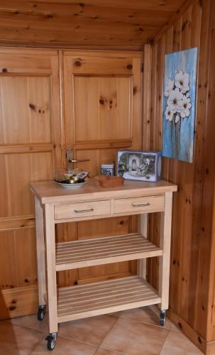 a wooden island in a room with wooden cabinets at Casa Barbóla in Sondalo