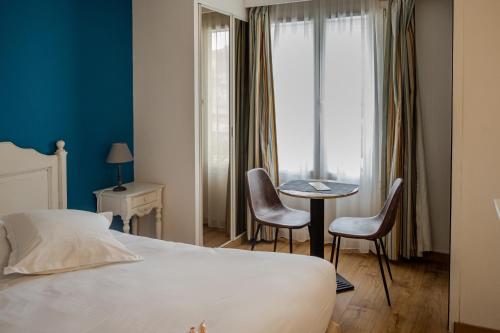Postel nebo postele na pokoji v ubytování Tulip Inn Honfleur Residence & Spa