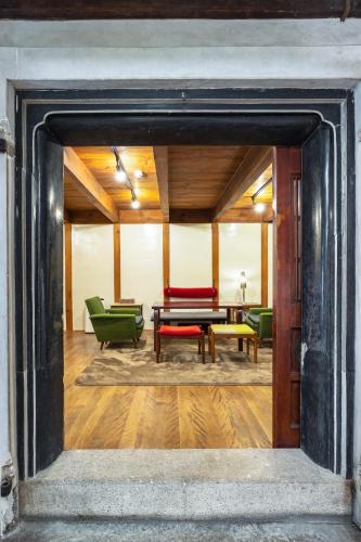 a view of a room with chairs and a table at Popotel 2 KURA in Matsumoto