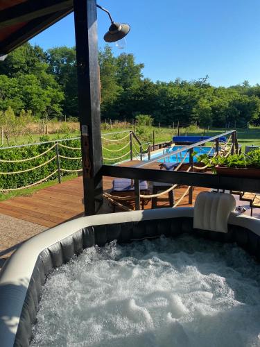 a pool of water in a hot tub on a deck at M&M Kuća za odmor in Vrbovec