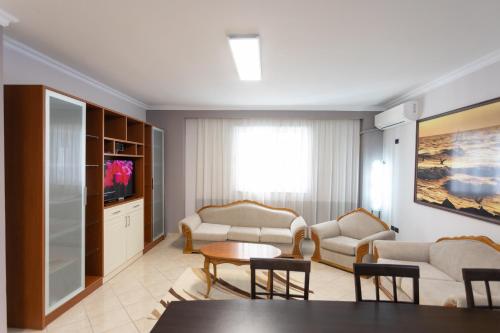Uma TV ou centro de entretenimento em Durres Port View Apartment