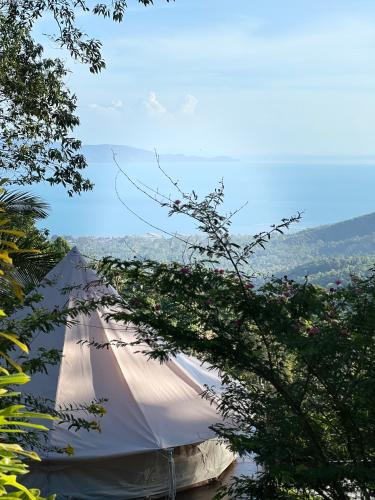 a large white tent with a view of a valley at The Hidden Gem Viewpoint Camping & Rooms in Ban Nok
