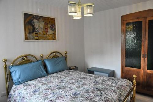 Ένα ή περισσότερα κρεβάτια σε δωμάτιο στο Casa Iride, appartamento con grazioso giardino