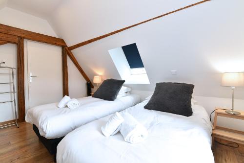 Una cama o camas en una habitación de Gîte Le 1531