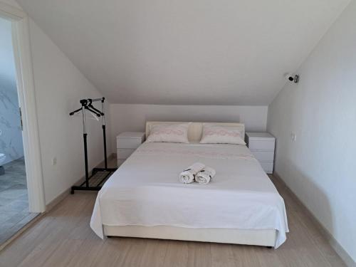 Postel nebo postele na pokoji v ubytování APARTMANI BELVEDERE BILO