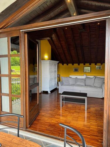 a living room with a couch and a table at La Casa di Nina - Traves in Pessinetto