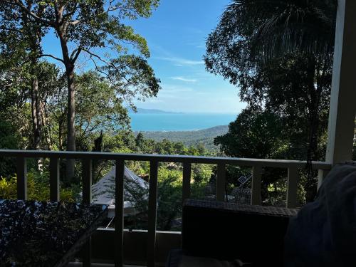 a view from the balcony of a house at The Hidden Gem Viewpoint Camping & Rooms in Ban Nok