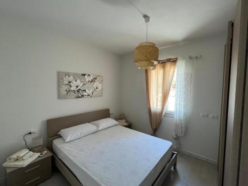 Ένα ή περισσότερα κρεβάτια σε δωμάτιο στο Casa Maris