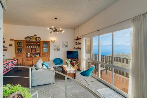 a living room with a view of the ocean at Sa Dias House by AH in São Jorge