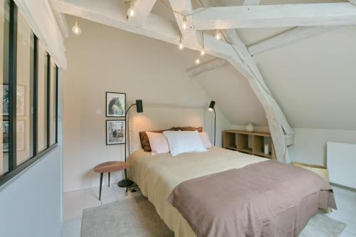 Postel nebo postele na pokoji v ubytování Le Cottage du Haras - Petite maison au calme