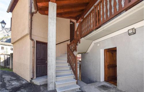 a staircase leading up to a building with a door at Isolina in Valsavarenche