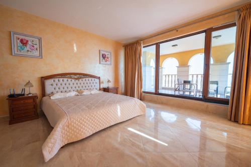 Ένα ή περισσότερα κρεβάτια σε δωμάτιο στο VILLAS GOLF