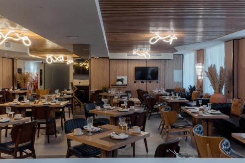 Телевизор и/или развлекательный центр в Qazaq Hotel Premium