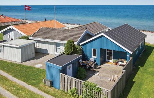 an overhead view of a blue house on the beach at Holiday Home Ny Bamsestræde O-624 in Otterup