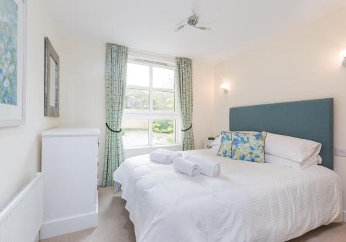 a bedroom with two beds and a window at Old Tolbooth Wynd - 388 in Edinburgh