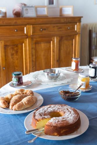 a table with two plates of pastries and bread at Fattoria di Rignana Winery BnB in Greve in Chianti